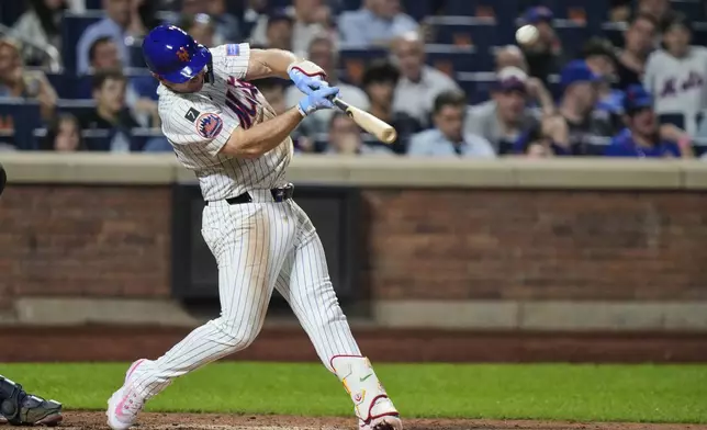 New York Mets' Pete Alonso hits a home run during the sixth inning of a baseball game against the Atlanta Braves Tuesday, Aug. 12, 2025, in New York. (AP Photo/Frank Franklin II)