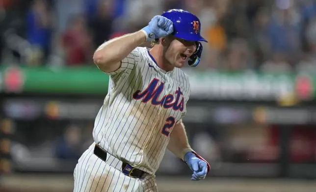 New York Mets' Pete Alonso celebrates as he runs the bases after hitting a home run during the sixth inning of a baseball game against the Atlanta Braves Tuesday, Aug. 12, 2025, in New York. (AP Photo/Frank Franklin II)