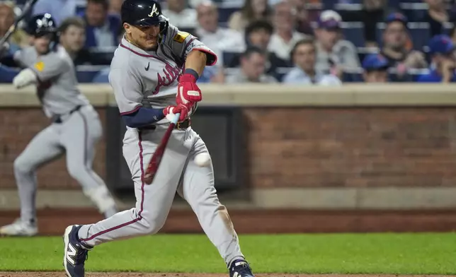 Atlanta Braves' Nacho Alvarez Jr. hits a two-run double during the fourth inning of a baseball game against the New York Mets Tuesday, Aug. 12, 2025, in New York. (AP Photo/Frank Franklin II)