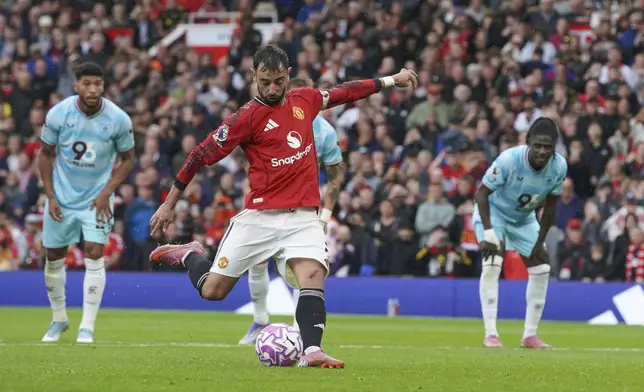 Manchester United's Bruno Fernandes shoots a penalty kick to score during the English Premier League soccer match between Manchester United and Burnley at Old Trafford stadium in Manchester, England, Saturday, Aug. 30, 2025. (AP Photo/Ian Hodgson)