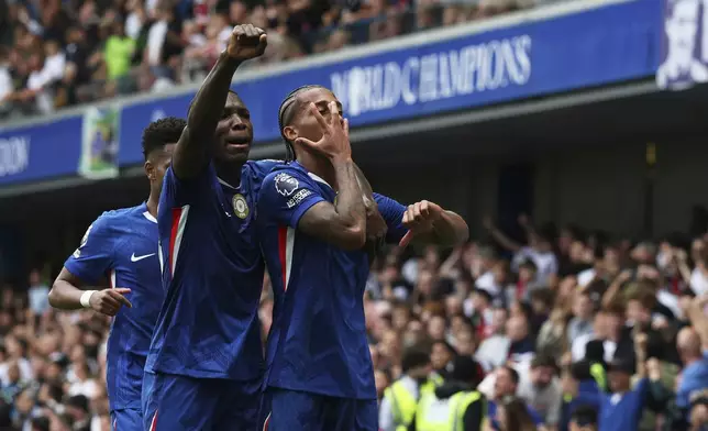 Chelsea's Joao Pedro, right, celebrates with teammates after scoring the opening goal during the English Premier League soccer match between Chelsea and Fulham at Stamford Bridge stadium in London, Saturday, Aug 30, 2025. (AP Photo/Ian Walton)