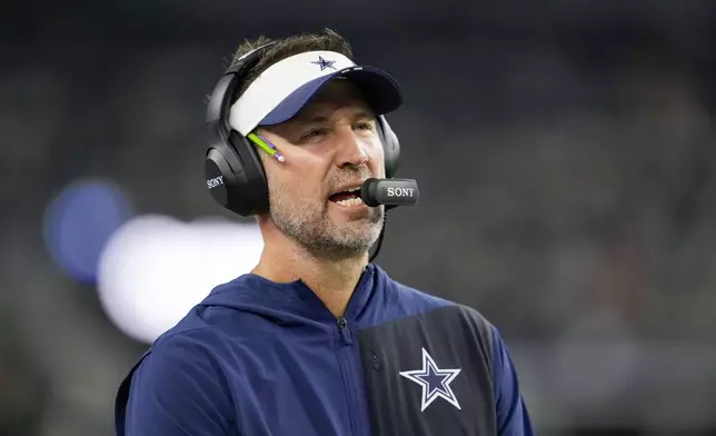 Dallas Cowboys head coach Brian Schottenheimer looks on during the second half of a preseason NFL football game against the Atlanta Falcons Friday, Aug. 22, 2025, in Arlington, Texas. (AP Photo/Tony Gutierrez)