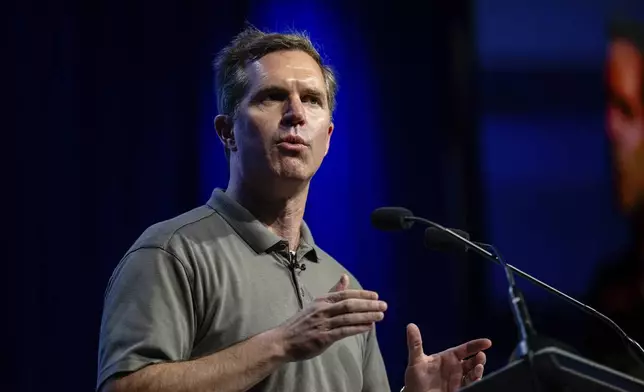 Kentucky Governor Andy Beshear speaks on stage at GE Appliances global headquarters, Wednesday, Aug 13, 2025, in Louisville, Ky. (AP Photo/Jon Cherry)