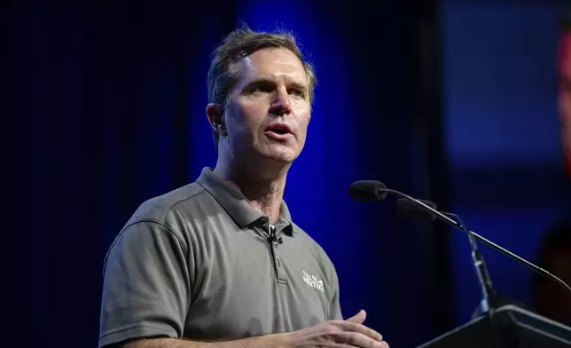 Kentucky Governor Andy Beshear speaks on stage at GE Appliances global headquarters, Wednesday, Aug 13, 2025, in Louisville, Ky. (AP Photo/Jon Cherry)