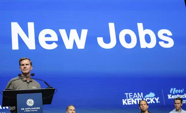 Kentucky Governor Andy Beshear speaks on stage at GE Appliances global headquarters, Wednesday, Aug 13, 2025, in Louisville, Ky. (AP Photo/Jon Cherry)