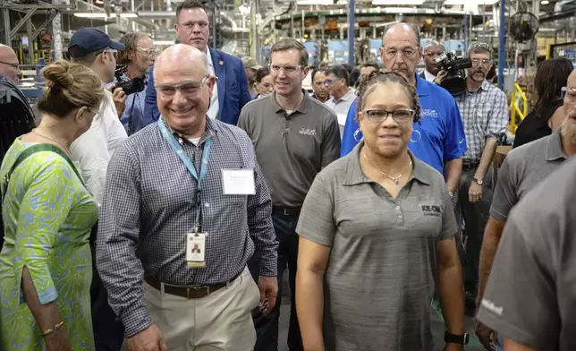 Kentucky Governor Andy Beshear tours an assembly line at GE Appliances global headquarters, Wednesday, Aug 13, 2025, in Louisville, Ky. (AP Photo/Jon Cherry)