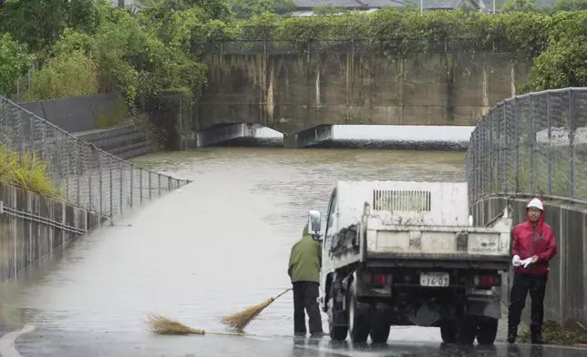 A road is flooded follwoing a heavy rain in Nagasu town, Kumamoto prefecture, southern Japan Monday, Aug. 11, 2025. (Naoki Hiraoka/Kyodo News via AP)