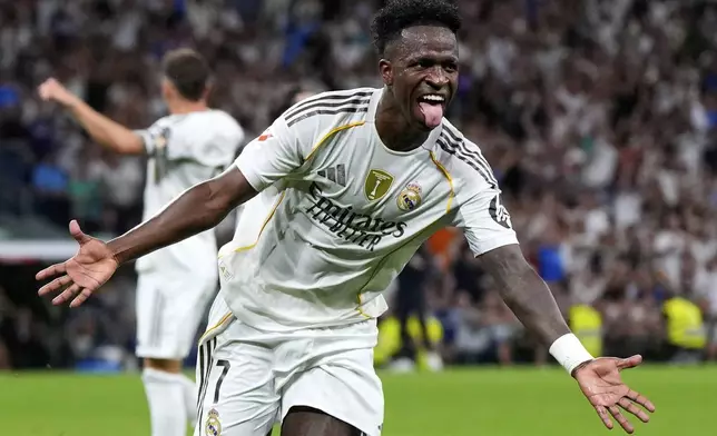 Real Madrid's Vinicius Junior celebrates scoring his side's second goal during the Spanish La Liga soccer match between Real Madrid and Mallorca in Madrid, Saturday, Aug. 30, 2025. (AP Photo/Manu Fernandez)