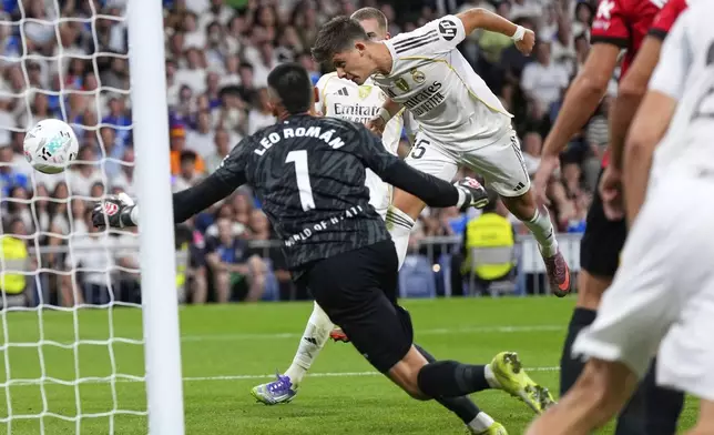 Real Madrid's Arda Guler scores his side's first goal during the Spanish La Liga soccer match between Real Madrid and Mallorca in Madrid, Saturday, Aug. 30, 2025. (AP Photo/Manu Fernandez)
