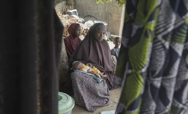 Aisha Muhammed, a 25-year-old woman, who had eclampsia, is photographed at her house in Konduga, in northeast Nigeria's Borno state, Wednesday, July 23, 2025. (AP Photo/Sunday Alamba)