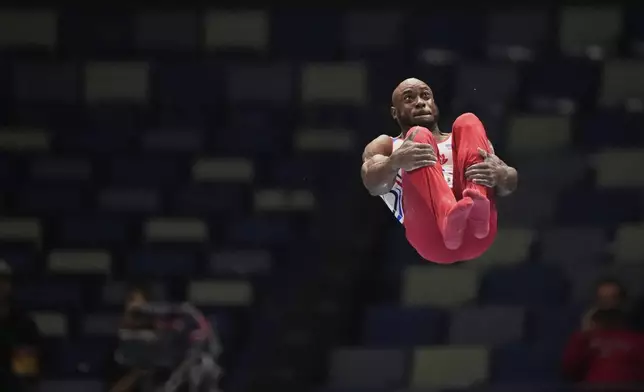 Donnell Whittenburg of EVO Gymnastics competes on the parallel bars during the senior men's finals of the U.S. Gymnastics Championships in New Orleans, Saturday, Aug. 9, 2025. (AP Photo/Gerald Herbert)