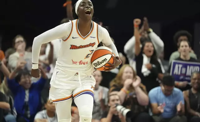 Phoenix Mercury guard Kahleah Copper celebrates a win against the Chicago Sky as time expires in the second half of a WNBA basketball game Thursday, Aug. 28, 2025, in Phoenix. (AP Photo/Ross D. Franklin)