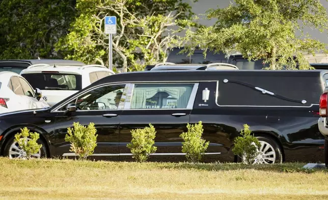 A hearse containing the remains of Terry Bollea, better know as wrestler Hulk Hogan, leaves after a memorial service at Indian Rocks Baptist Church, Tuesday, Aug. 5, 2025, in Largo, Fla. (Luis Santana/Tampa Bay Times via AP)