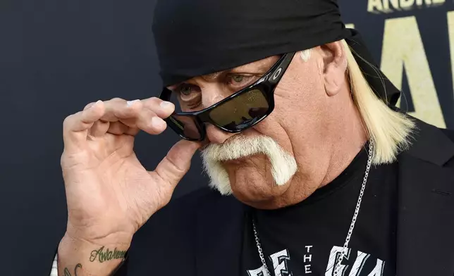 FILE - Professional wrestler Hulk Hogan poses for photographers, March 29, 2018, in Los Angeles. (Photo by Chris Pizzello/Invision/AP, File)