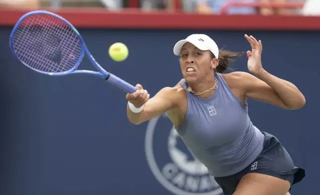 Madison Keys, of the United States, hits a return to Karolina Muchova, of Czechia, during round of 16 match action at the National Bank Open women's tennis tournament in Montreal, Sunday, Aug. 3, 2025. (Christinne Muschi/The Canadian Press via AP)