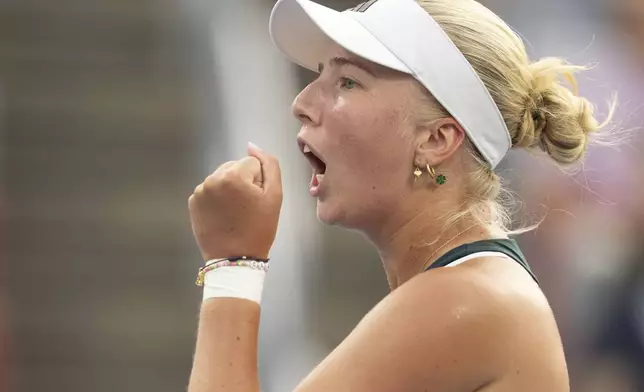 Clara Tauson, of Denmark, reacts during her match against Iga Swiatek, of Poland, during round of 16 action at the National Bank Open women's tennis tournament in Montreal, Sunday, Aug. 3, 2025. (Christinne Muschi/The Canadian Press via AP)