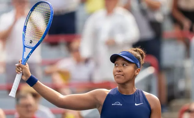 Naomi Osaka, of Japan, celebrates after her win over Anastasija Sevastova, of Latvia, during round of 16 match action at the National Bank Open women's tennis tournament in Montreal, Sunday, Aug. 3, 2025. (Christinne Muschi/The Canadian Press via AP)