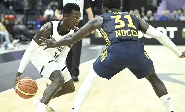 Sweden's Barra Njie, right, and Germany's Dennis Schroeder during Eurobasket, European Basketball Championship group B match between Germany and Sweden in Tampere, Finland, Friday, Aug. 29, 2025. (Heikki Saukkomaa/Lehtikuva via AP)