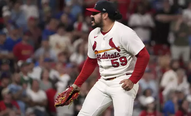 St. Louis Cardinals relief pitcher JoJo Romero celebrates after getting Chicago Cubs' Matt Shaw to ground into a force out ending a baseball game Sunday, Aug. 10, 2025, in St. Louis. (AP Photo/Jeff Roberson)
