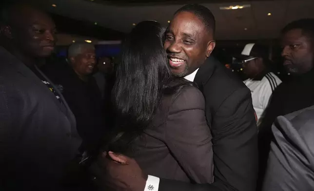 Detroit mayoral candidate Solomon Kinloch Jr. hugs supporters at a campaign watch party Tuesday, Aug. 5, 2025, in Detroit. (AP Photo/Ryan Sun)