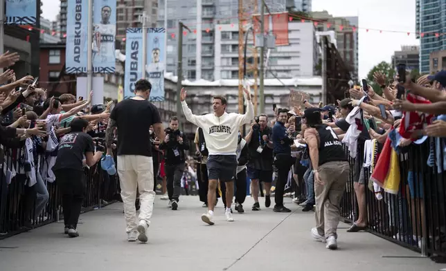 Vancouver Whitecaps' Thomas Muller arrives before an MLS soccer match against Houston Dynamo in Vancouver, British Columbia, Sunday, Aug. 17, 2025. (Ethan Cairns/The Canadian Press via AP)