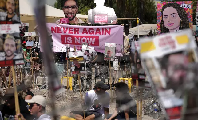 Families of hostages protest, demanding the release from Hamas captivity in the Gaza Strip, at the plaza known as the hostages square in Tel Aviv, Israel, Saturday, Aug. 2, 2025. (AP Photo/Ariel Schalit)