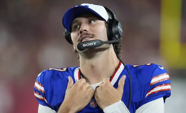 Buffalo Bills quarterback Josh Allen watches during the first half of an NFL preseason football game against the Tampa Bay Buccaneers, Saturday, Aug. 23, 2025, in Tampa, Fla. (AP Photo/Chris O'Meara)