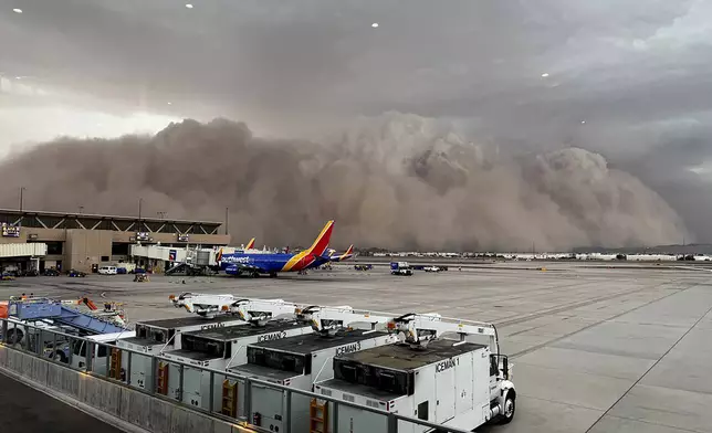This photo provided by the City of Phoenix shows a towering cloud of dust at Phoenix Sky Harbor International Airport on Monday, Aug. 25, 2025. (City of Phoenix via AP)
