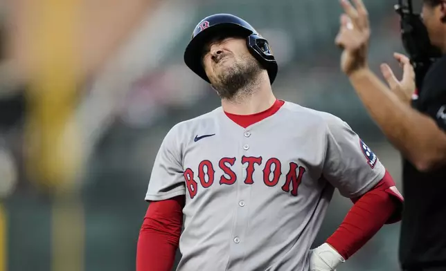 Boston Red Sox's Alex Bregman reacts after being hit by a pitch by Baltimore Orioles relief pitcher Roansy Contreras during the third inning of a baseball game, Wednesday, Aug. 27, 2025, in Baltimore. (AP Photo/Stephanie Scarbrough)