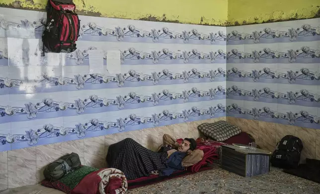 An Afghan youth living at the Imam al-Tirmidhi religious school takes a break between classes in Kabul, Afghanistan, Wednesday, June 11, 2025. (AP Photo/Ebrahim Noroozi)