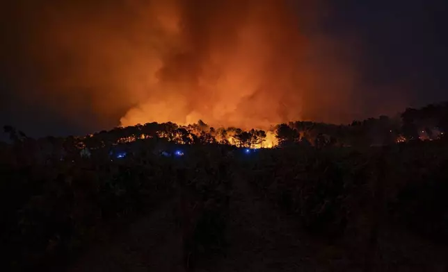 This photo, provided by the Securite Civile on Thursday Aug. 7, 2025, shows the wildfire near Saint-Laurent-de-la-Cabrerisse, southern France, Wednesday, Aug. 6, 2025. (Securite Civile via AP)