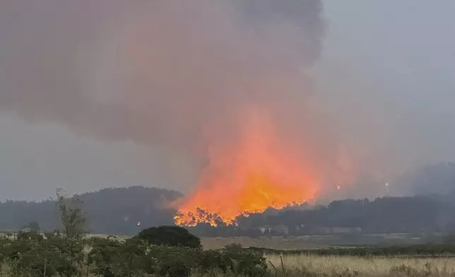 France's biggest wildfire this summer is, raging, near Durban-Corbieres, southern France, Wednesday, Aug.6, 2025. (AP Photo/Hernan Munoz)
