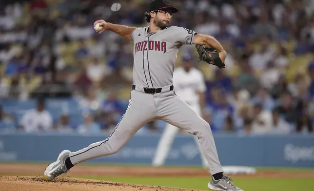 Arizona Diamondbacks starting pitcher Zac Gallen throws to the plate during the first inning of a baseball game against the Los Angeles Dodgers, Friday, Aug. 29, 2025, in Los Angeles. (AP Photo/Mark J. Terrill)