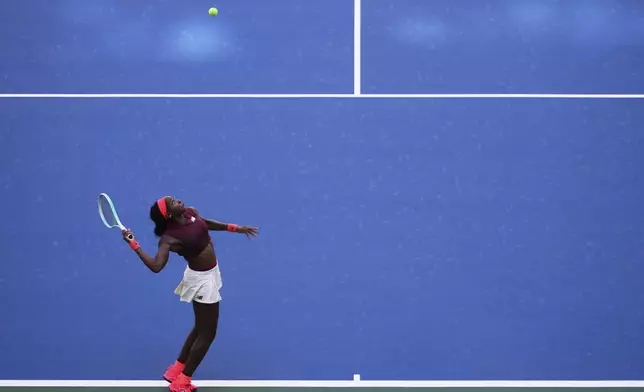 Coco Gauff, of the United States, serves during the third round of the U.S. Open tennis championships, Saturday, Aug. 30, 2025, in New York. (AP Photo/Kirsty Wigglesworth)