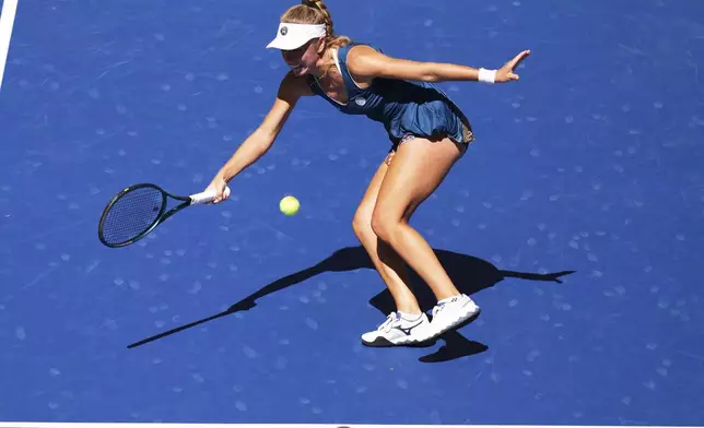 Magdalena Frech, of Poland, returns a shot against Coco Gauff, of the United States, during the third round of the U.S. Open tennis championships, Saturday, Aug. 30, 2025, in New York. (AP Photo/Kirsty Wigglesworth)