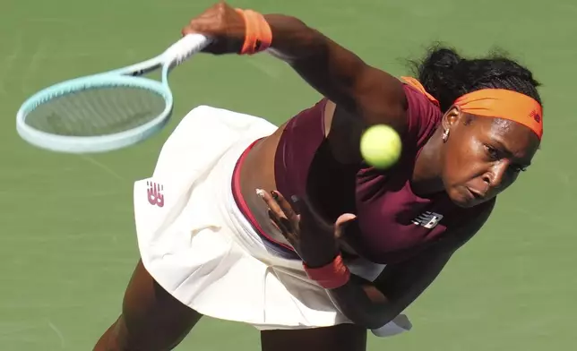 Coco Gauff, of the United States, serves against Magdalena Frech, of Poland, during the third round of the U.S. Open tennis championships, Saturday, Aug. 30, 2025, in New York. (AP Photo/Kirsty Wigglesworth)