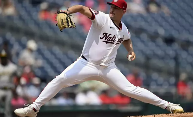 Washington Nationals starting pitcher Mitchell Parker throws during the first inning of a baseball game against the Athletics, Thursday, Aug. 7, 2025, in Washington. (AP Photo/John McDonnell)