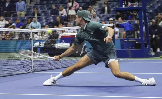 Tommy Paul, of the United States, returns a shot to Nuno Borges, of Portugal, during the second round of the U.S. Open tennis championships, Thursday, Aug. 28, 2025, in New York. (AP Photo/Frank Franklin II)