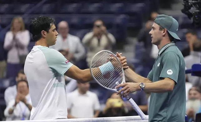 Nuno Borges, left, of Portugal, congratulates Tommy Paul, of the United States, after being defeated by him during the second round of the U.S. Open tennis championships, Thursday, Aug. 28, 2025, in New York. (AP Photo/Frank Franklin II)