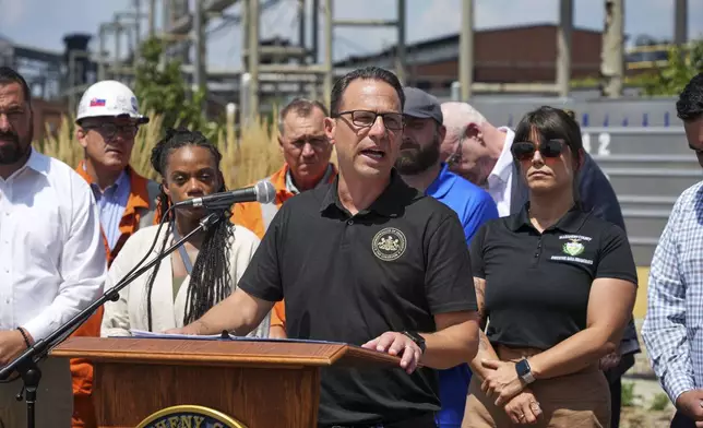 Pennsylvania Governor Josh Shapiro talks with media at the Clairton Coke Works, a U.S. Steel plant, in Clairton, Pa., Tuesday, Aug. 12, 2025. (AP Photo/Gene J. Puskar)