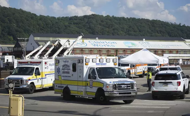 Ambulances are seen after an explosion at the Clairton Coke Works, a U.S. Steel coking plant, Monday, Aug 11, 2025, in Clairton, Penn. (AP Photo/Gene Puskar)