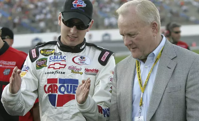 FILE - Kyle Busch, left, and H.A. "Humpy" Wheeler, President of Lowe's Motor Speedway, chat prior to qualifying in Concord, N.C., May 26, 2005. (AP Photo/Gerry Broome, file)