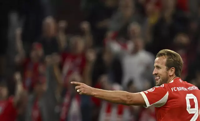 Bayern Munich's Harry Kane celebrates scoring during the Bundesliga soccer match between Bayern Munich and RB Leipzig at Allianz Arena, Munich, Germany, Friday Aug. 22, 2025. (Sven Hoppe/dpa via AP)