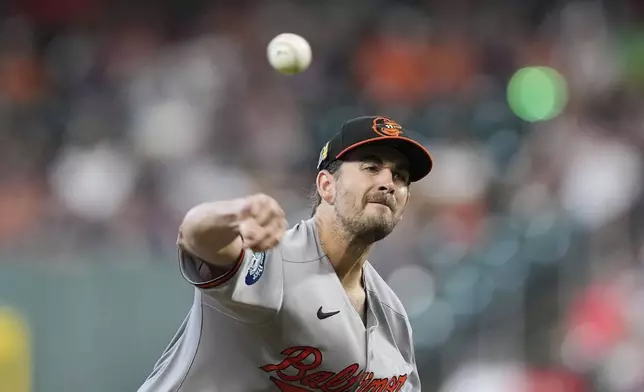 Baltimore Orioles starting pitcher Dean Kremer throws against the Houston Astros during the first inning of a baseball game Sunday, Aug. 17, 2025, in Houston. (AP Photo/David J. Phillip)