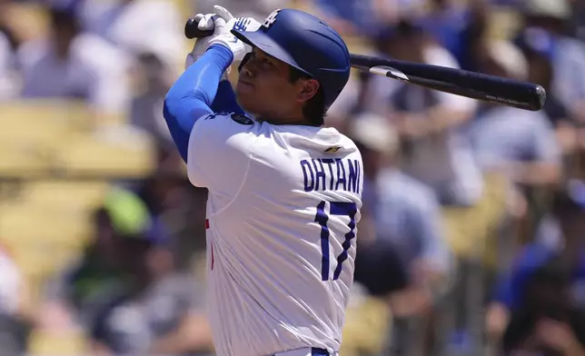 Los Angeles Dodgers' Shohei Ohtani hits a two-run home run and his 1,000th hit during the third inning of a baseball game Wednesday, Aug. 6, 2025, in Los Angeles. (AP Photo/Mark J. Terrill)