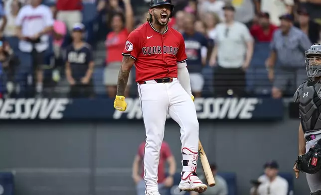 Cleveland Guardians' Gabriel Arias reacts after hitting a three-run home run off Miami Marlins starting pitcher Eury Pérez during the fourth inning of a baseball game, Wednesday, Aug. 13, 2025, in Cleveland. (AP Photo/David Dermer)