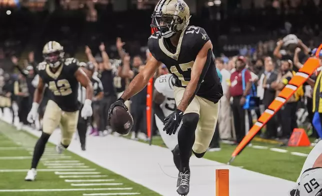 New Orleans Saints wide receiver Dante Pettis (17) scores a touchdown against the Jacksonville Jaguars on a 20-yard pass play in the second half of an NFL preseason football game in New Orleans, Sunday, Aug. 17, 2025. (AP Photo/Gerald Herbert)