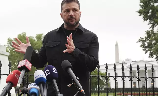 Ukraine's President Volodymyr Zelenskyy speaks in Lafayette Park, across from the White House, after meeting with President Donald Trump and European leaders Monday, Aug. 18, 2025, in Washington. (AP Photo/Jacquelyn Martin)