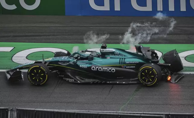 Aston Martin driver Lance Stroll of Canada sits in his car after a crash during the second practice for the Formula One Dutch Grand Prix in Zandvoort, Netherlands, Friday, Aug. 29, 2025. (AP Photo/Patrick Post)