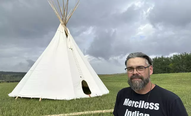 Turtle Mountain Band of Chippewa Tribal Chairman Jamie Azure poses for a photo near a tepee on Wednesday, July 23, 2025, at the Turtle Mountain Recovery Center on the tribe's reservation near Belcourt, N.D. (AP Photo/Jack Dura)